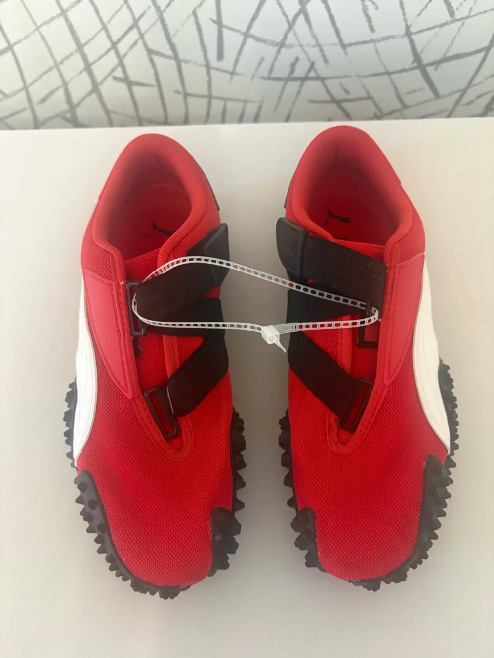 PUMA Mostro OG Sneakers. Vibrant  Red with a Unique Spike Sole.